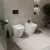   HD Madrid Glossy White perem nélküli mély öblítésű íves álló WC slim "L" tetővel és matt fekete zsanérral